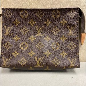 Genuine vintage Louie Vuitton cosmetic pouch pre codes.